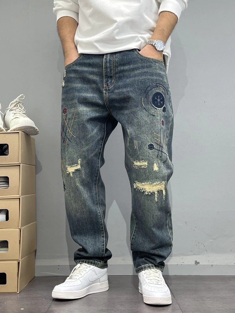 Patch-Embroidered: Vintage Ripped Tapered Denim 2026