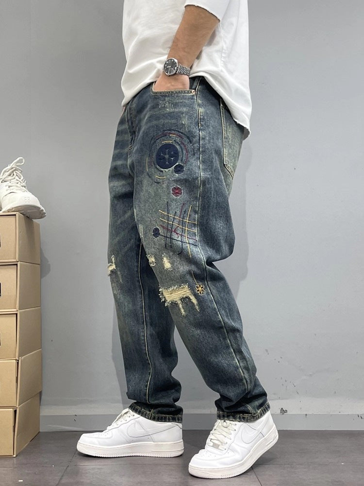 Patch-Embroidered: Vintage Ripped Tapered Denim 2026