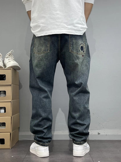 Patch-Embroidered: Vintage Ripped Tapered Denim 2026